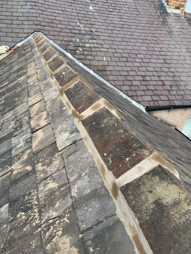 ridge tiles cemented on top of a roof