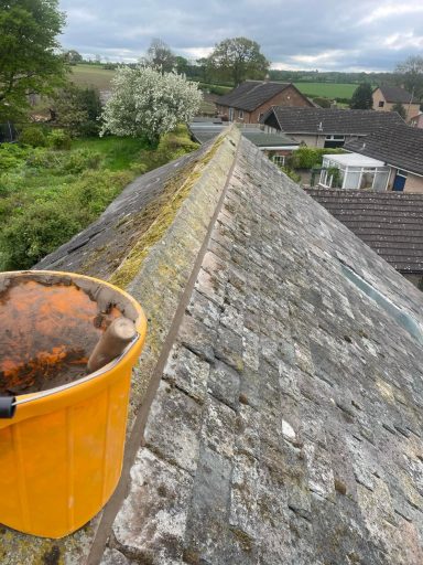 ridge repair work on a roof