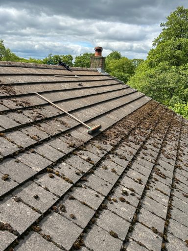 a roof being cleaned