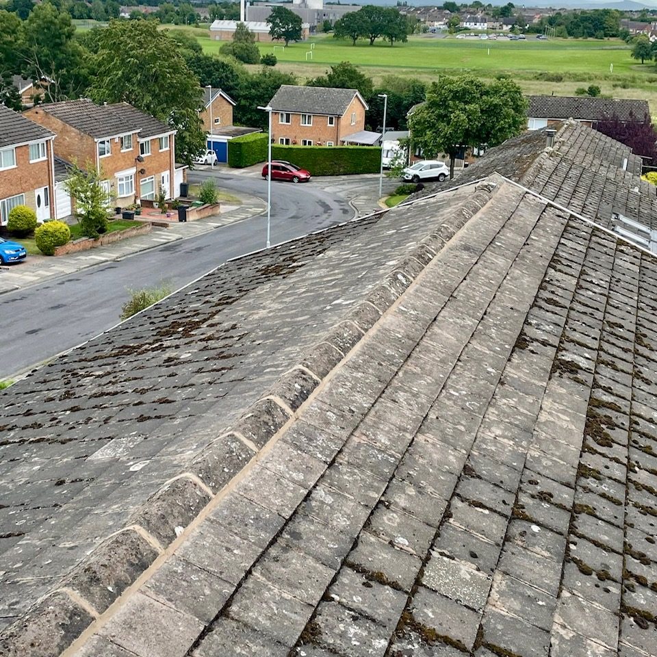 top of a pitcher roof looking onto houses