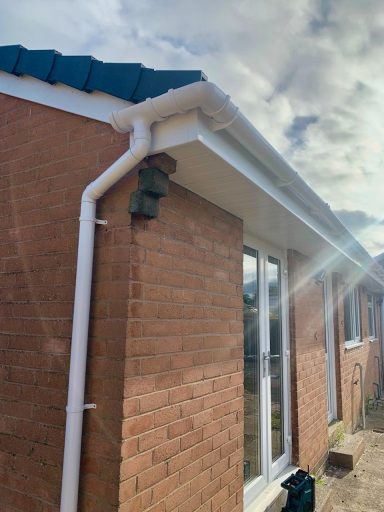 view of house showing replacement white uPVC guttering and facia