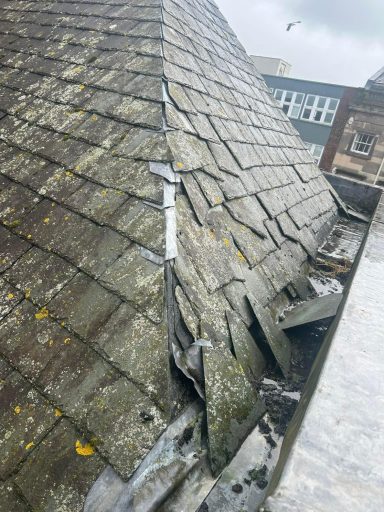 repairing broken slates on a roof