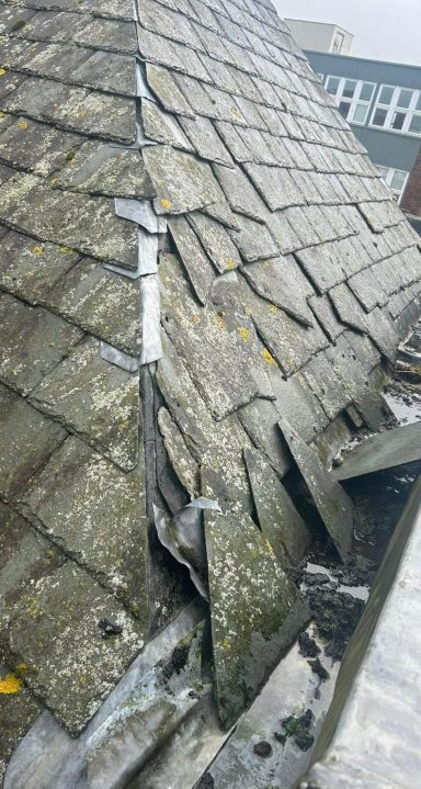 a damaged roof undergoing repair works