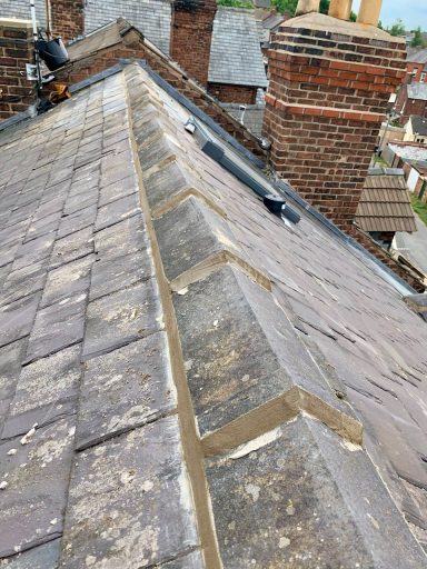 replacement ridge tiles on a roof