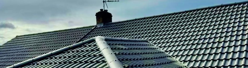 top of tile roof showing chimney stack